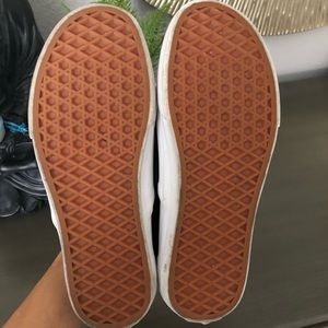 Black leather Vans slip on sneakers